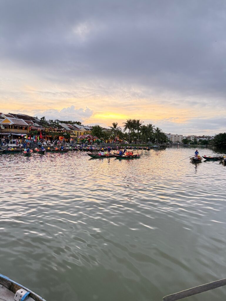 a group of people rowing boats