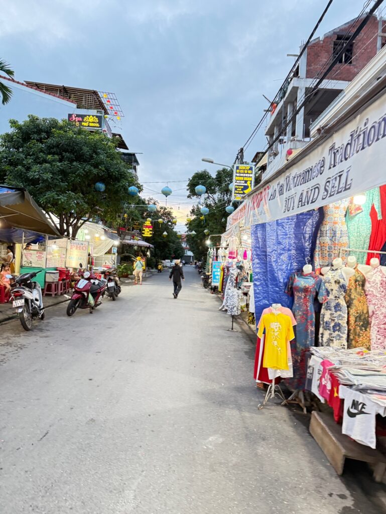 a street with people and shops