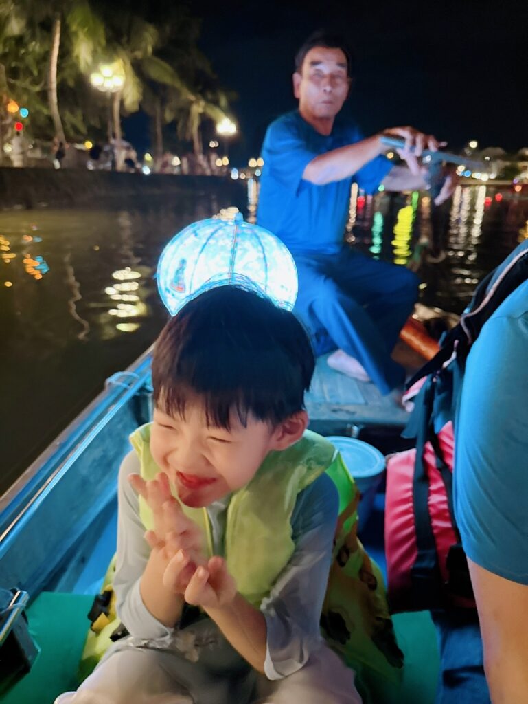 a person and a boy on a boat