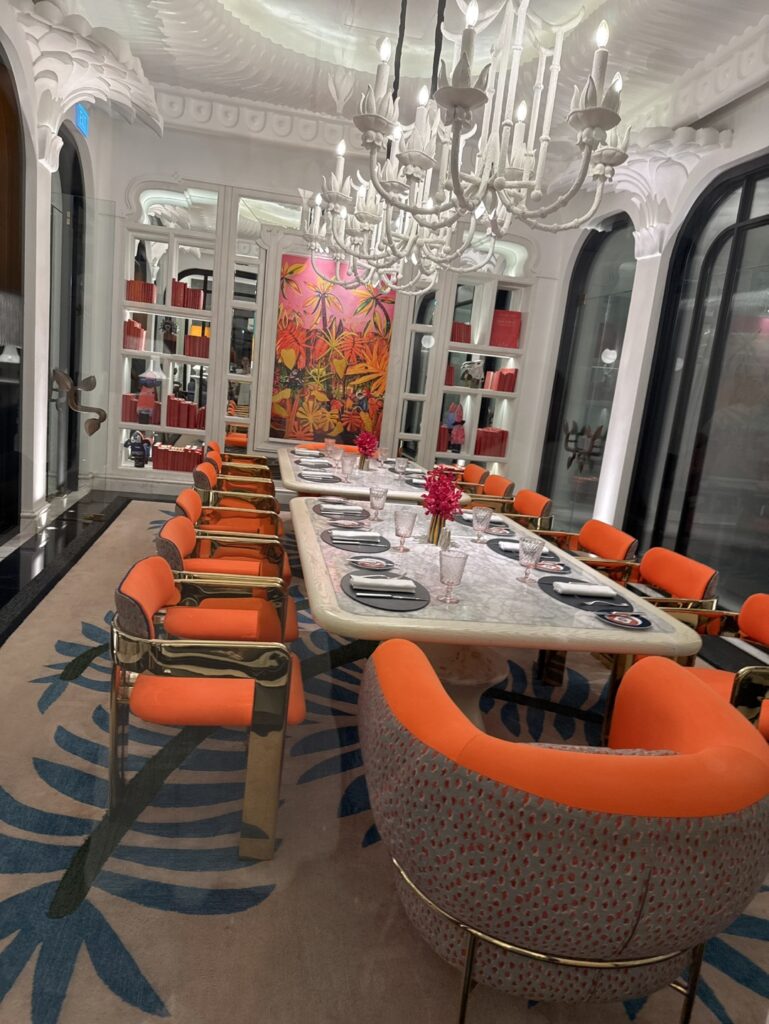 a dining room with orange chairs