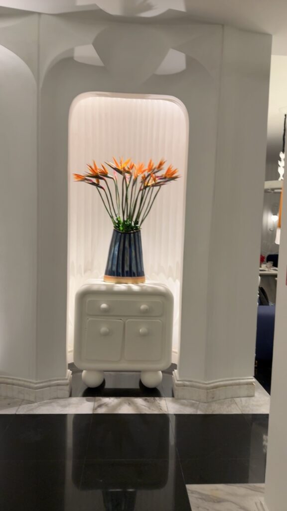 a vase with flowers on a toilet