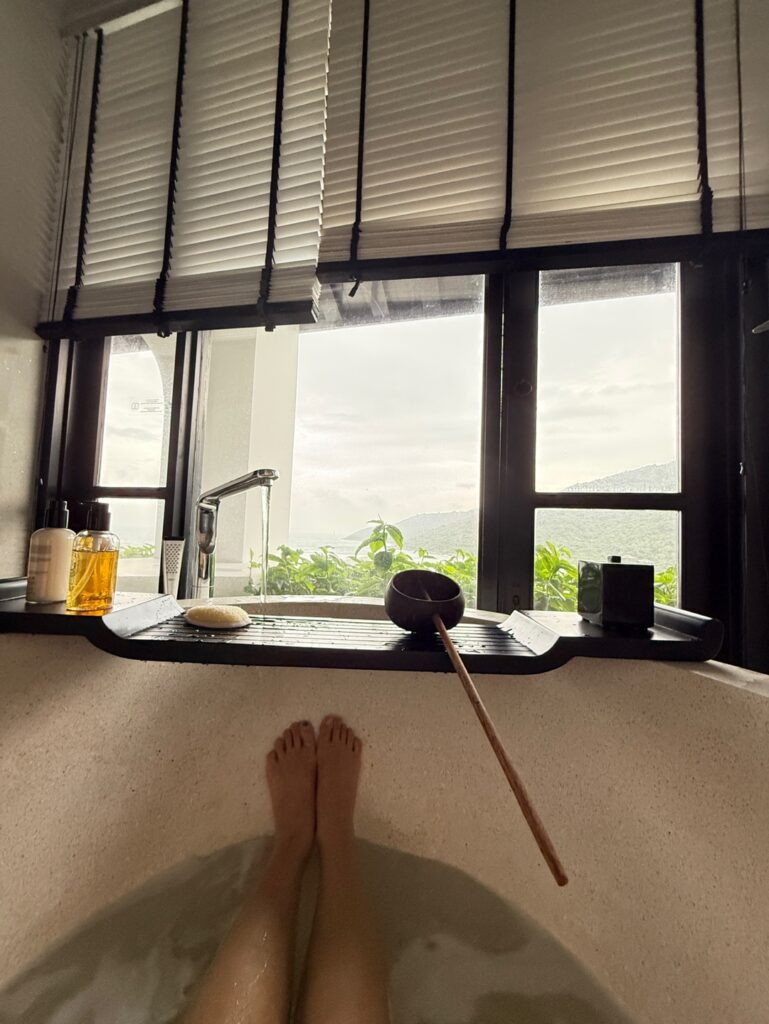 a person's feet on a counter by a window