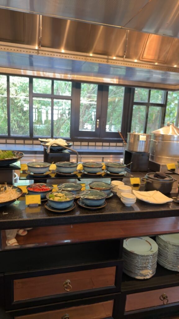 a kitchen counter with many plates and bowls on it