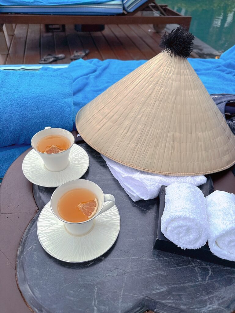 a table with cups of tea and a straw