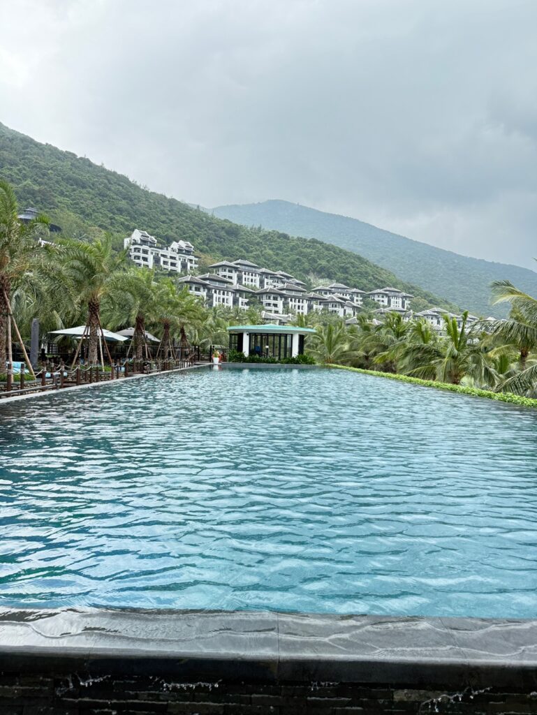 a body of water with buildings and trees around it