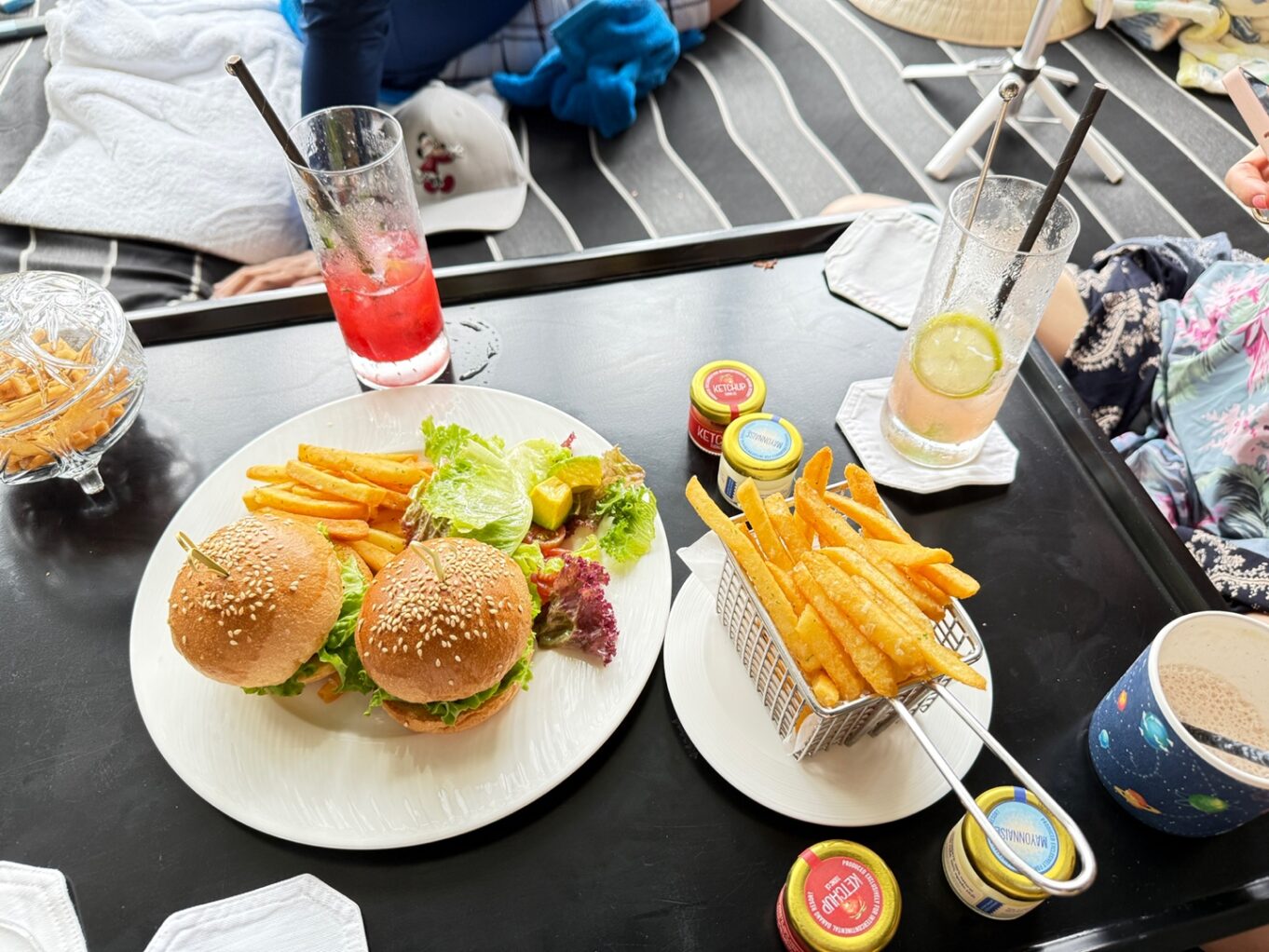 a table with plates of food and drinks on it