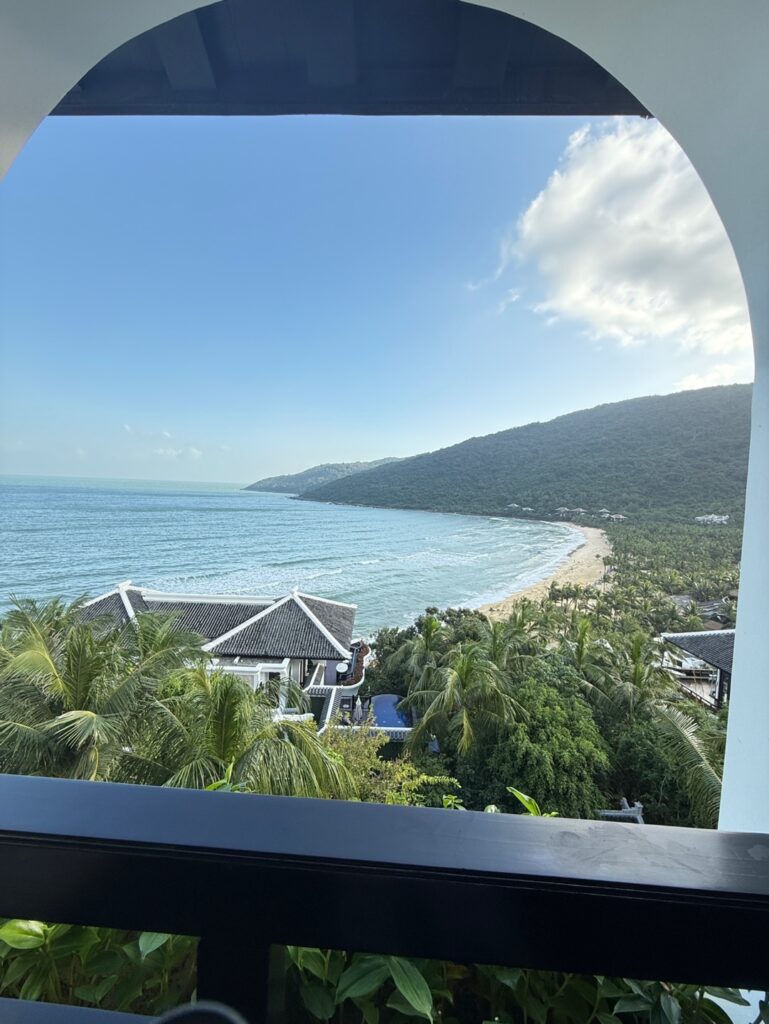 a view of a beach and ocean from a balcony