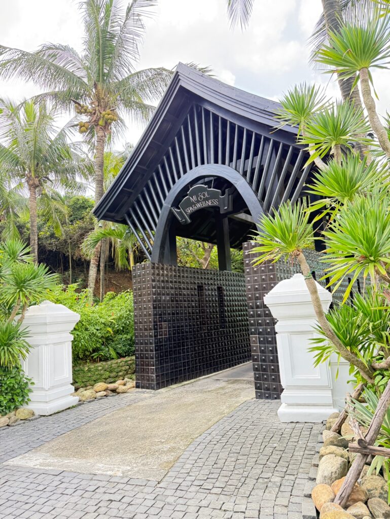 a black gate with a sign on it