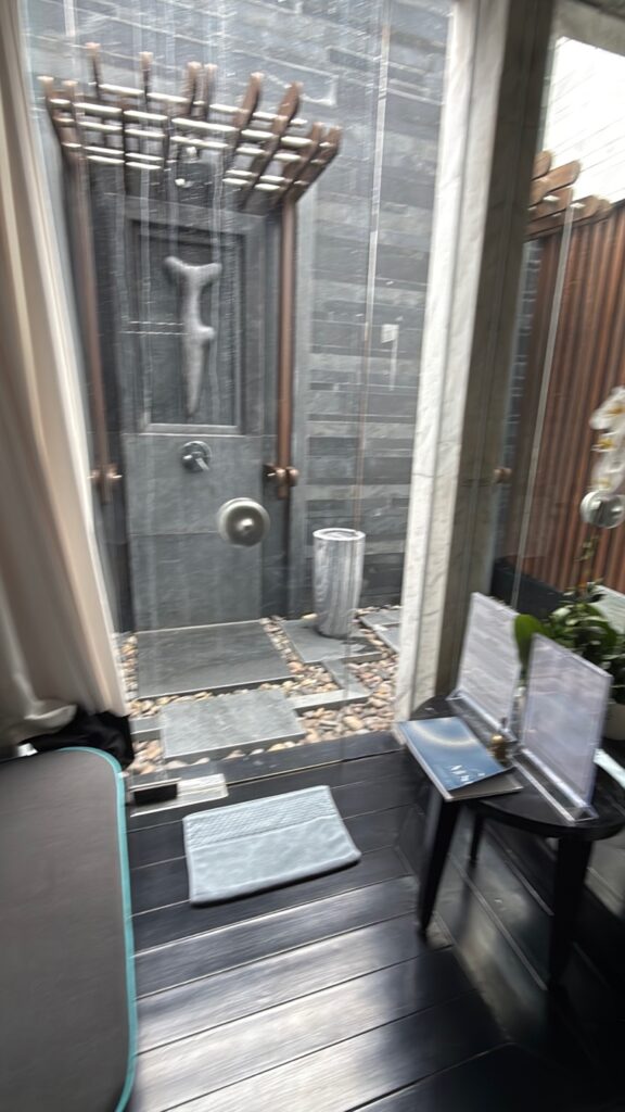 a bathroom with a glass door