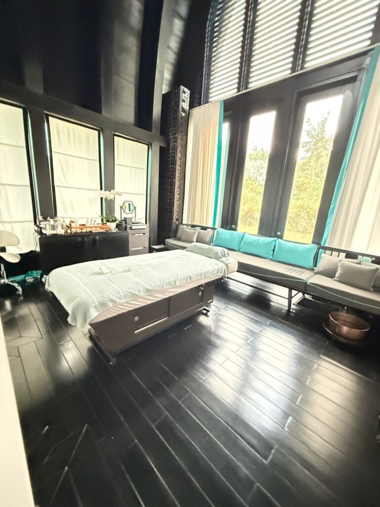 a large bedroom with a large bed