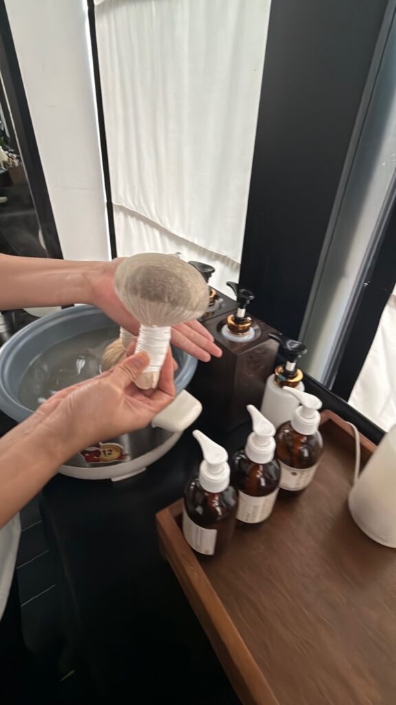 a person washing a child's hands in a sink