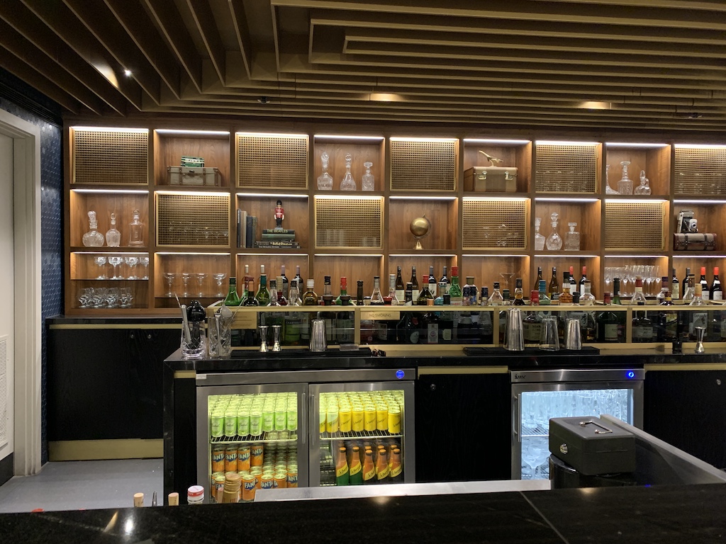 a bar with many bottles of alcohol