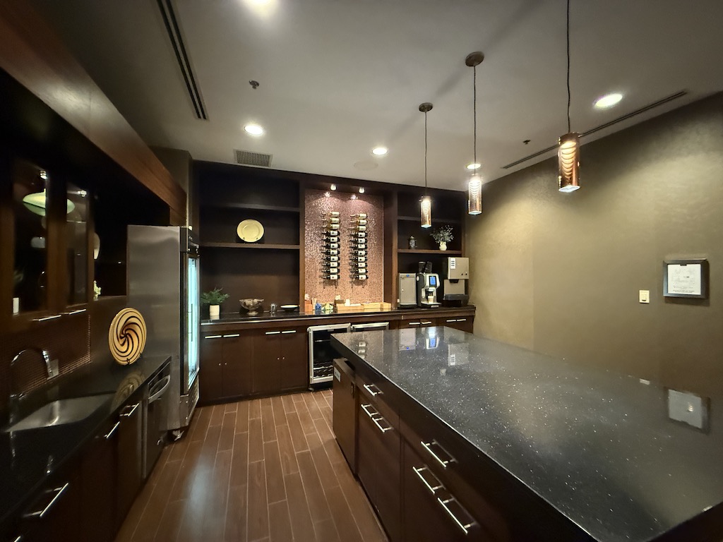 a kitchen with a bar and a counter