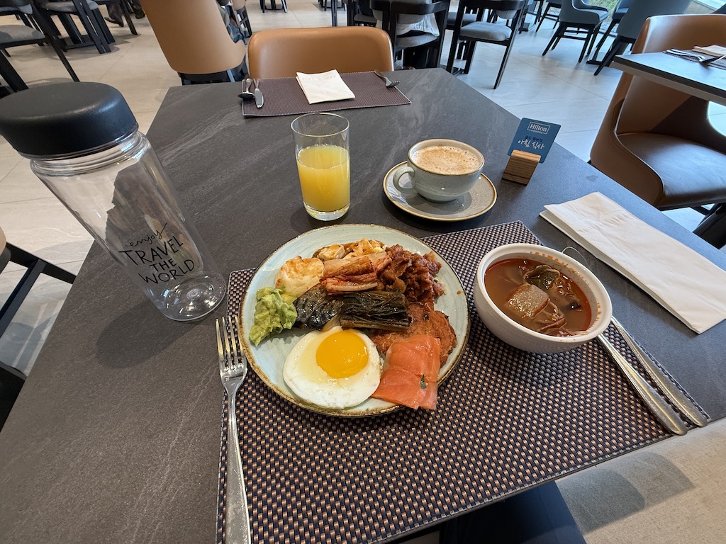 a plate of food and drinks on a table