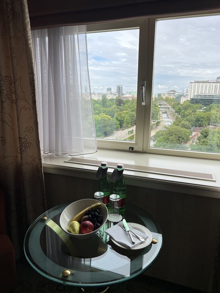 a table with food and bottles on it by a window